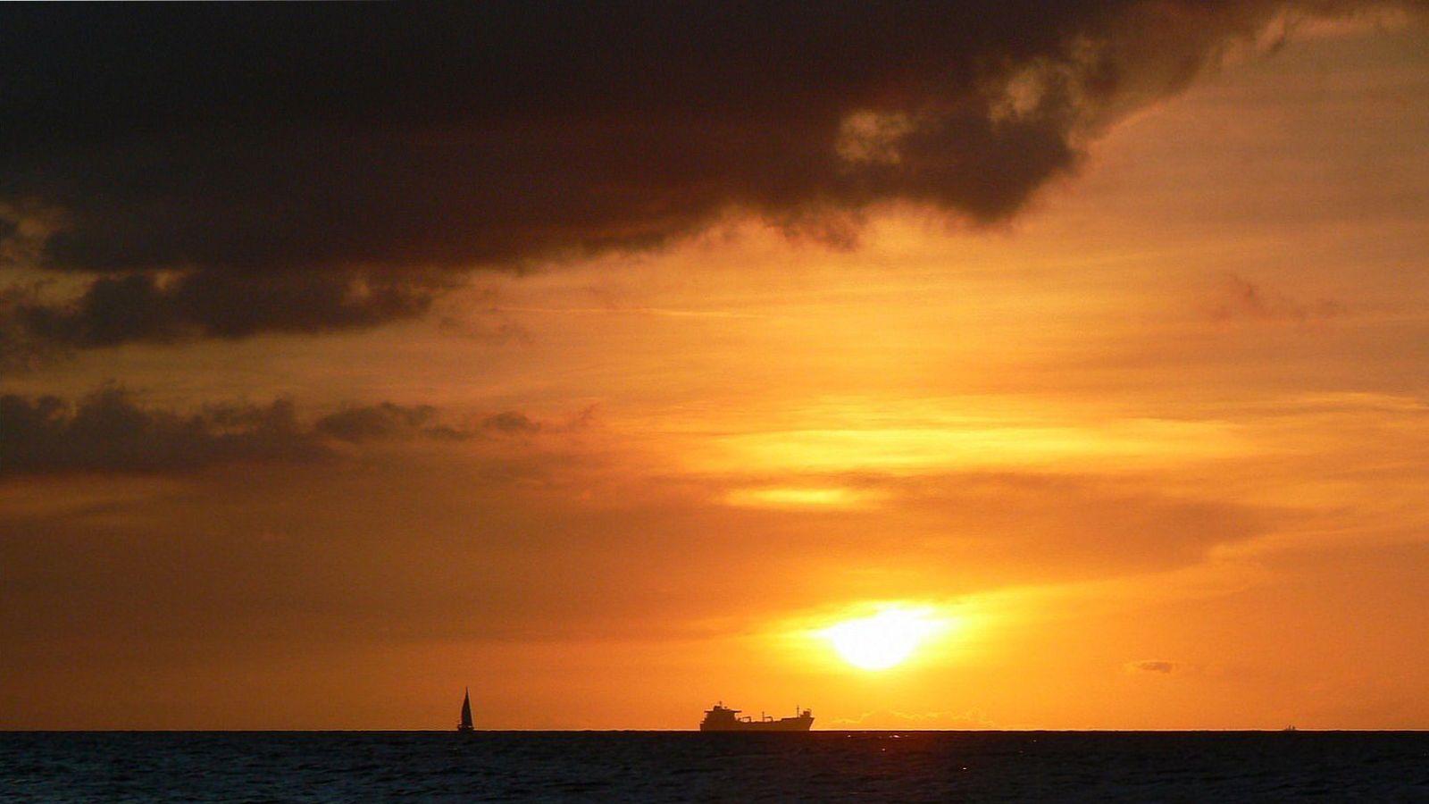 Sfeerfoto bij: Zonsondergang op Curaçao: hier zie je de zon het mooist in zee zakken